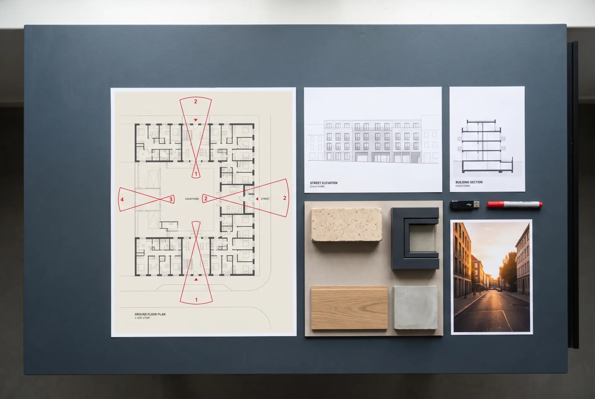 A complete rendering file pack laid out from above: a floor plan with red camera cones, an elevation, a section, a material board with brick, metal, oak and concrete samples, and a reference photo.