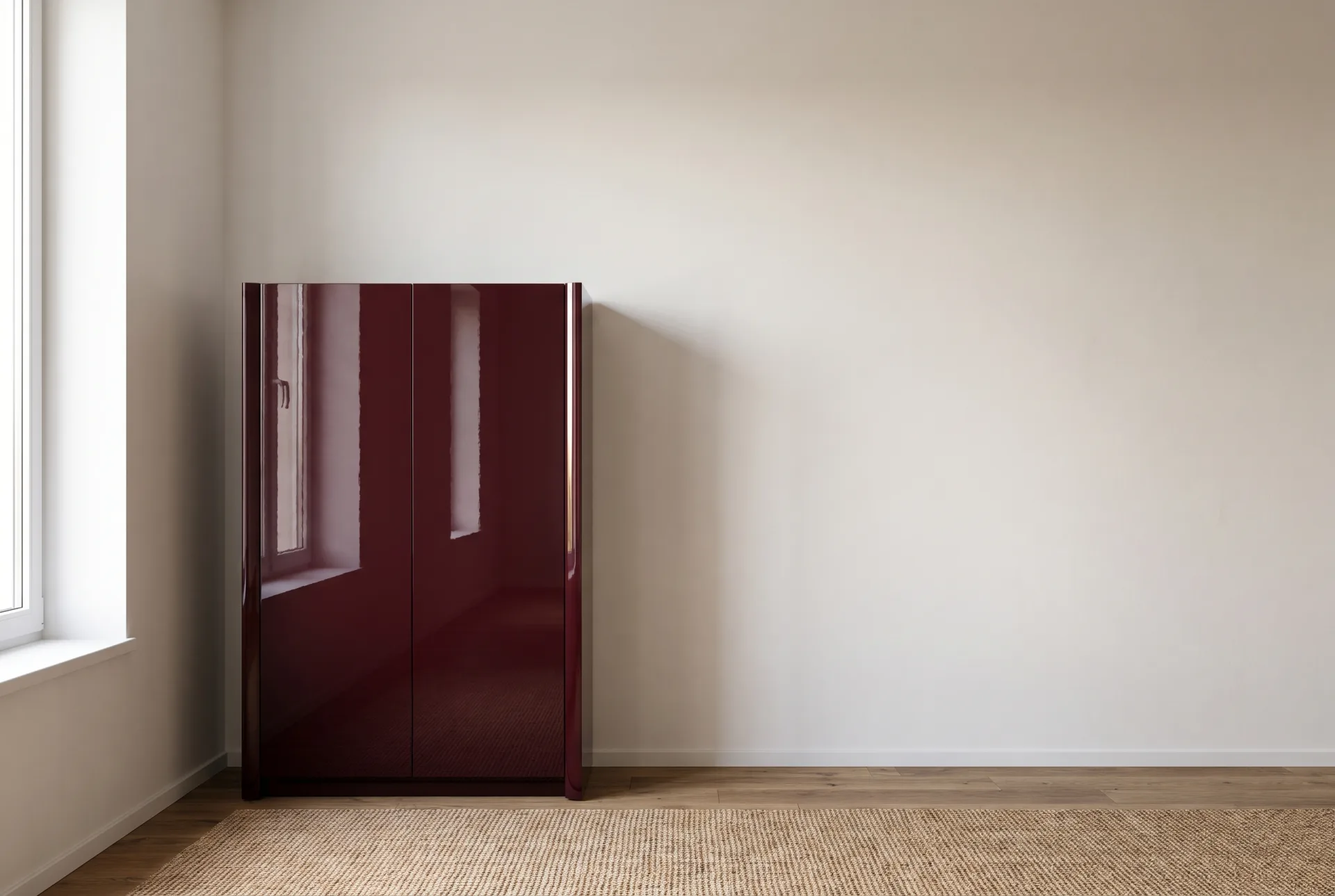 A matte plaster wall with only soft light on it beside a glossy burgundy lacquered sideboard that mirrors the window in sharp reflections.