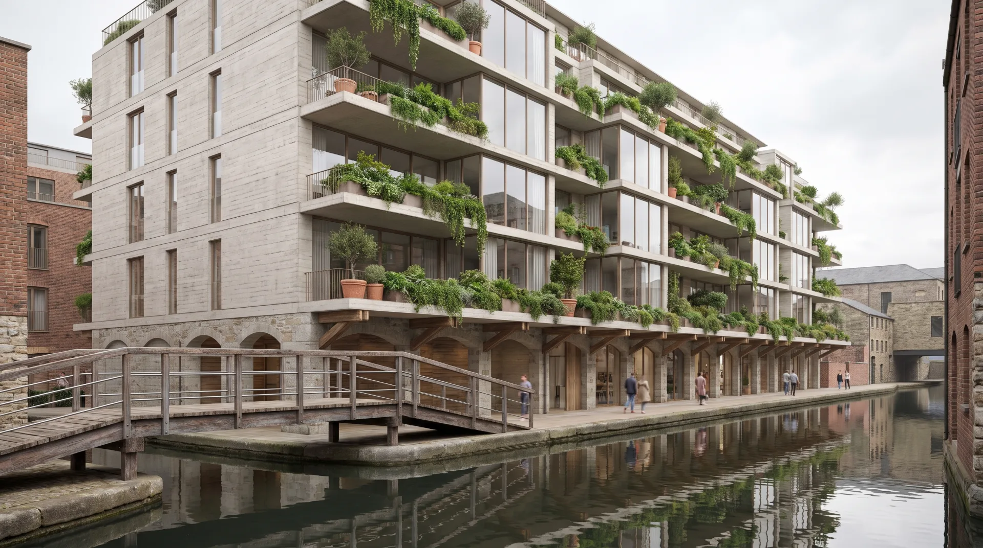 A six-story concrete and glass apartment building with planted balconies, reflected in a city canal, seen from the far bank.