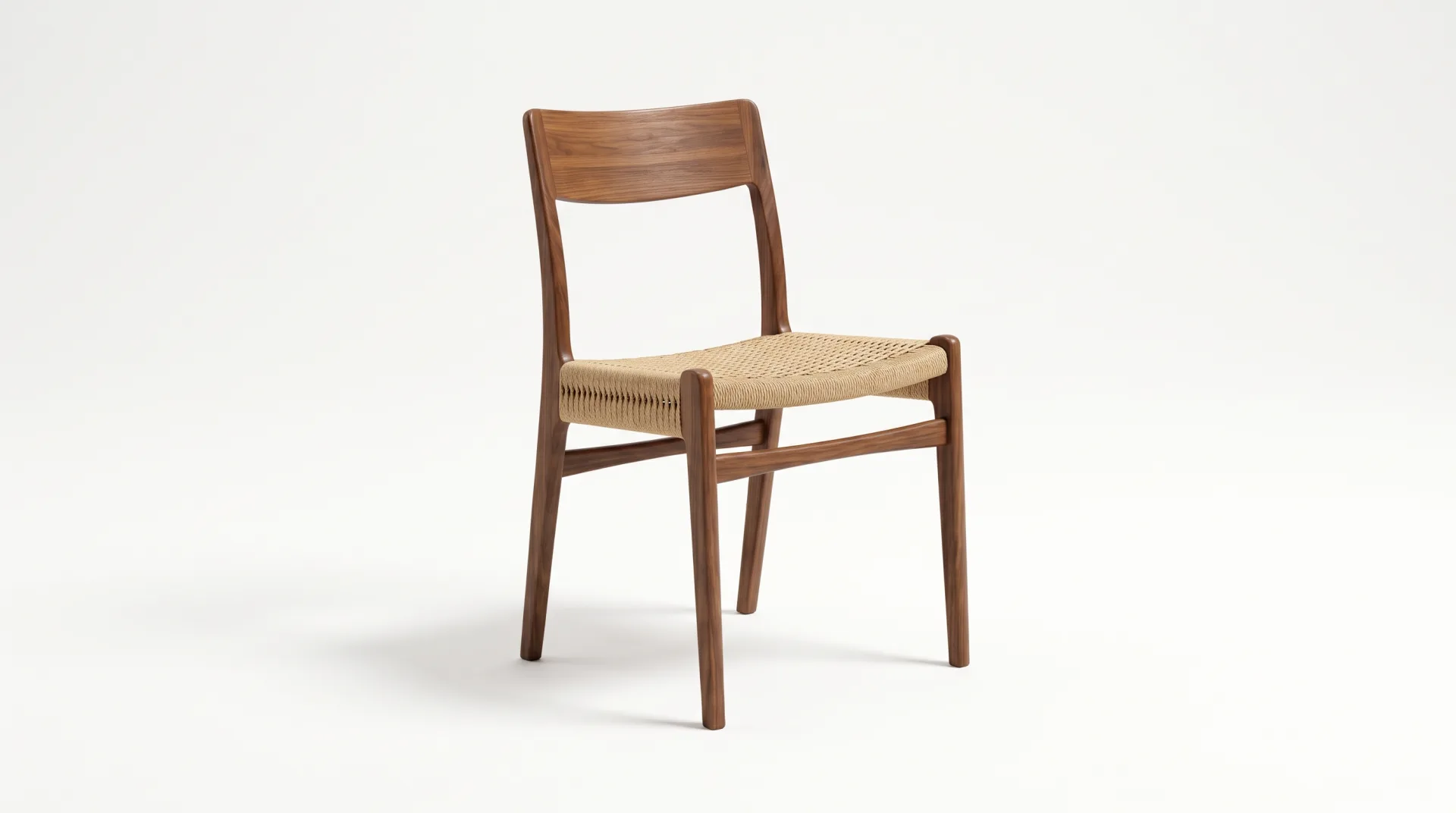 Concept work: a walnut dining chair with a woven cord seat on a pure white background.